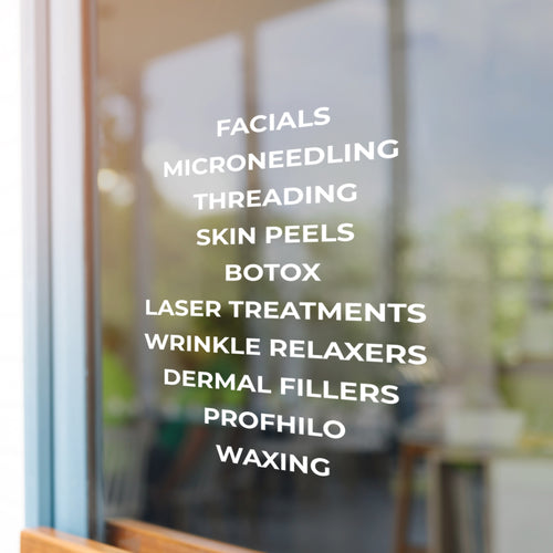 List of cosmetic treatments on a blurred background of a salon.