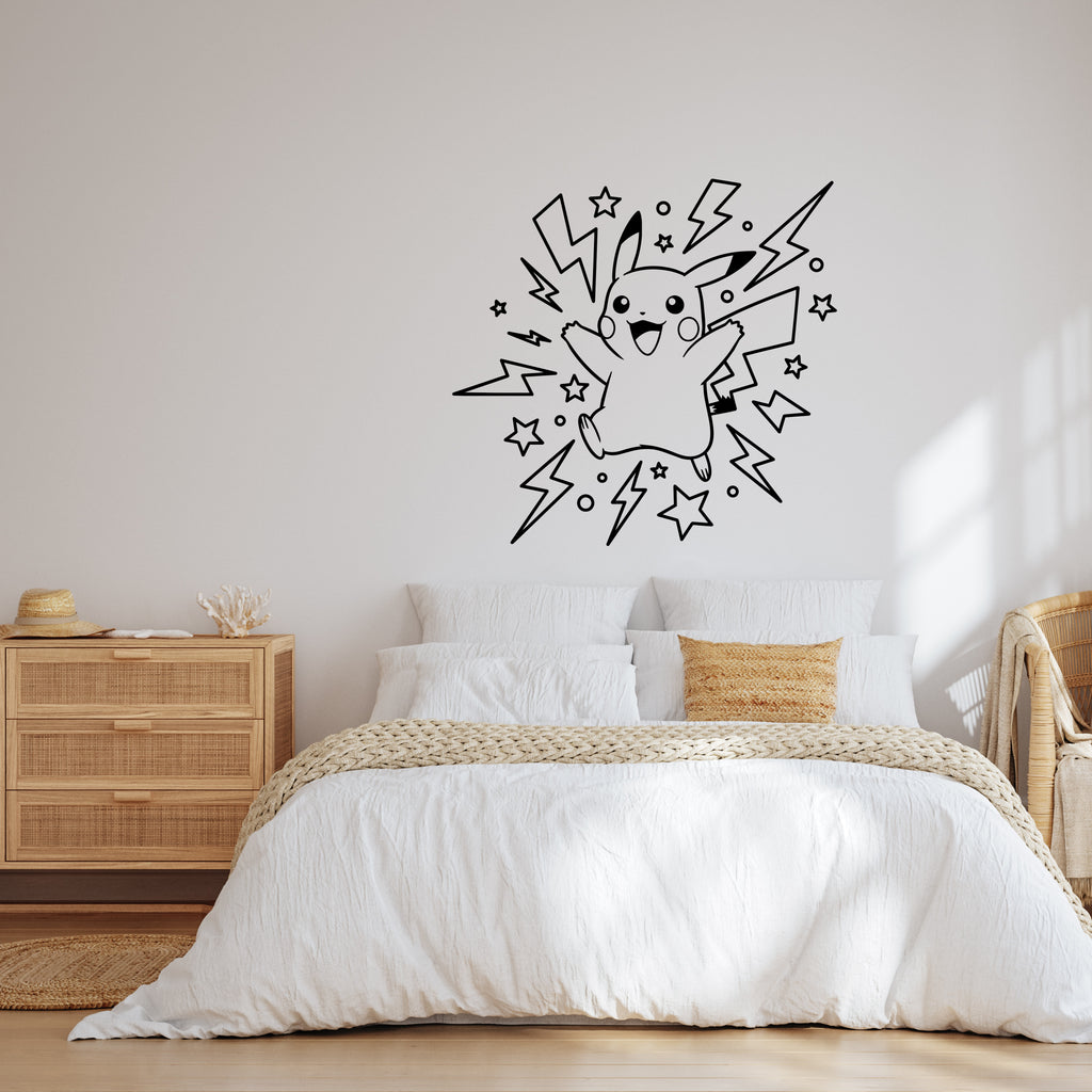 A black vinyl wall decal of Pikachu surrounded by lightning bolts and stars, displayed on a light beige wall above a neatly made bed in a modern, sunlit bedroom.